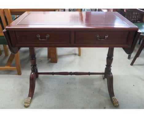 A 20th century hardwood two drawer drop end sofa table and a pair of single drawer lamp tables (3) Condition Report:Available