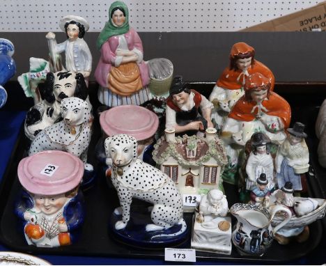 A pair of 19th century sash window stops in the form of seated toby's, a Scottish pottery fishwife, other figures, dogs etc C