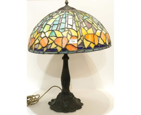 A stained and leaded glass lamp decorated with daffodils Condition Report:Available upon request