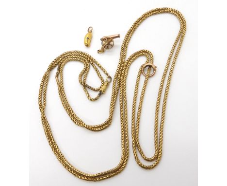 A yellow metal guard chain, length 144cm, weight 28.5gms, a French 18ct gold canon charm stamped with the eagles head, weight