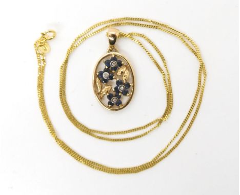 A 9ct gold diamond and sapphire flower pendant, pendant dimensions with bail 2.5cm x 1.3cm, with a 9ct trace chain length 50c