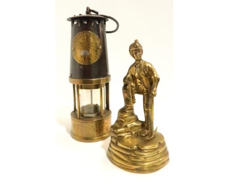 The Protector Lamp &amp; Lighting Co. Ltd Eccles Type SL safety miners lamp, and a brass figure of a miner Condition Report:A