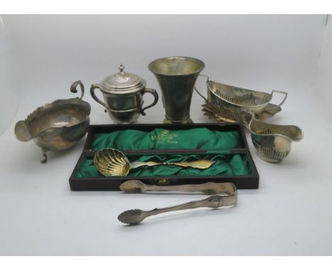 A collection of silver including a Georgian style silver sauce boat with flying scroll handle, by Streeter &amp; Co Ltd, Lond