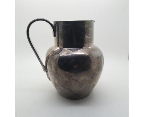 A Victorian silver pitcher, of plain form, by Mappin &amp; Webb, Sheffield 1897, 502gms Condition Report:Available upon reque