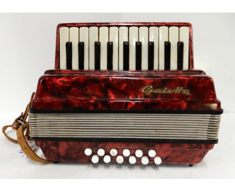 A 22 key 12 bass miniature Galotta accordion Condition Report:Available upon request