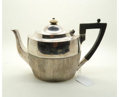 A Victorian silver teapot, of flattened form, the body fluted, with wooden handle and ivory finial, by James Deakin &amp; Son