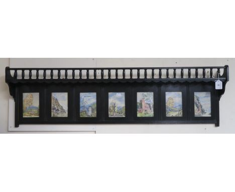 A Victorian ebonised wall shelf inset with seven watercolour panels Condition Report:Available upon request