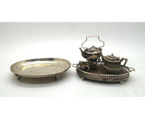 An Edwardian silver dolls house four piece tea service, comprising spirit kettle and stand, teapot, cream jug and sugar bowl,
