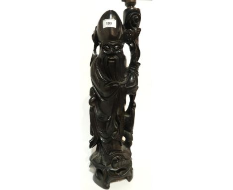 A carved dark wood and wire inlaid sage table lamp Condition Report:Available upon request