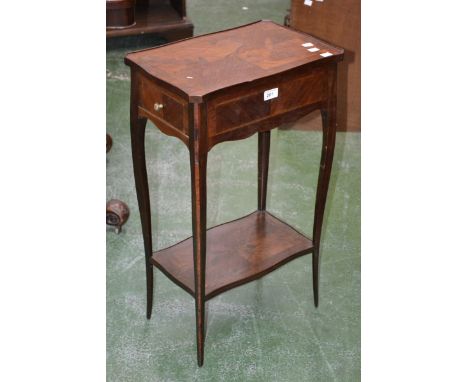 A late 19th century French mahogany work table, serpentine top, single drawer to frieze, tapering serpentine legs, under tier