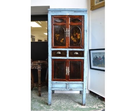 An Oriental tall cabinet, two doors painted with fighting Samurai over two short drawers, two panel doors to base, stile feet