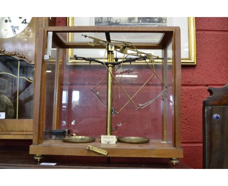 A set of 20th century scales in a glass case, Phillip Harris 277 Birmingham.