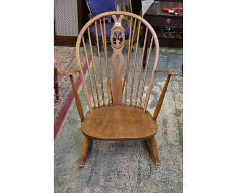 An Ercol style spindle back rocking chair.