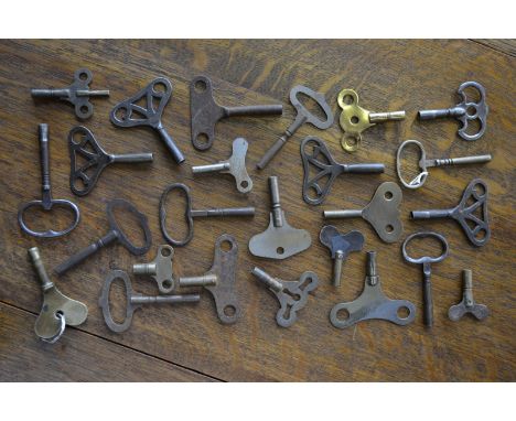 A collection of twenty five 19th century wall and bracket clock keys