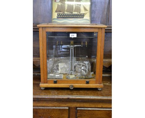 A set of scientific balance scales by Phillip Harris, Birmingham, with weights