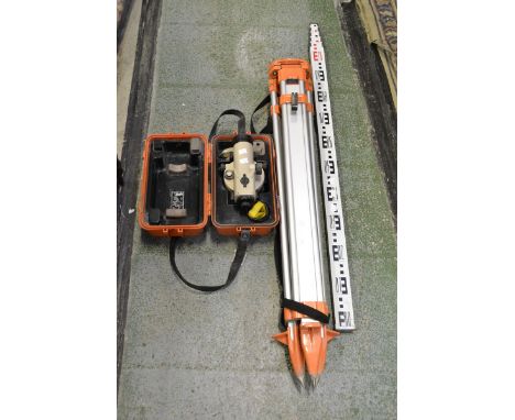 A Pentax AL M5C auto dumpy level with box and stand; a telescopic surveyor's measuring stick (3)
