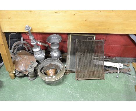 A 19th century cast iron marmite hook, another five 19th and early 20th century marmite hooks, two cast iron pot holders, a l