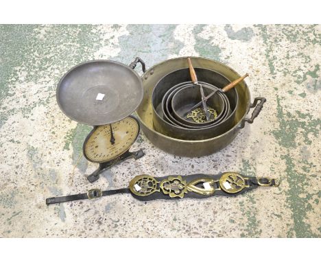 Kitchenalia - an early 20th century twin-handled brass jam pan; a set of balance scales; clear glass bottle stoppers; a gradu