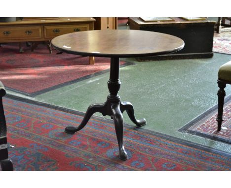 A George III mahogany occasional table, the circular top tilting on turned column, tripod legs, pointed pad feet, 80cm diam, 