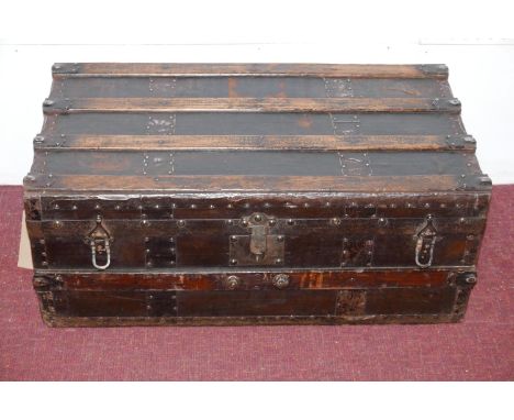 An early 20th century ash and iron bound vintage travelling trunk, H.31 W.78 D.43cm 