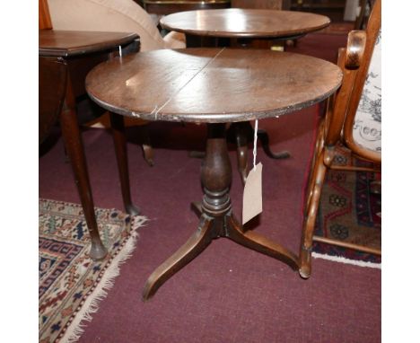 An antique oak circular occasional table on tripod base. H.66 W.64cm 