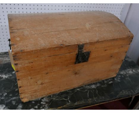 A 19th century Continental pine dome topped trunk, with hinged lid, H.33 W.56 D.38cm 