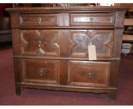 An early C18th oak chest of drawers with moulded lozenge drawers on bracket feet. H.79 W.100 D.57cm 