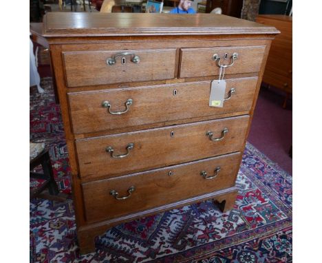 A Georgian oak chest of two short over three long drawers, raised on bracket feet, H.110 W.92 D.48cm 
