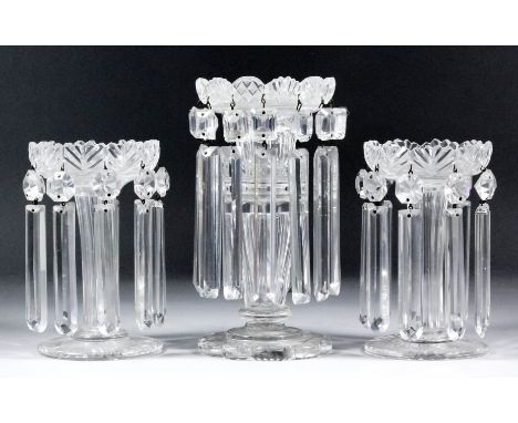 A pair of late Georgian clear cut glass lustres with slice cut stems, on circular feet, 6.25ins high, and a Georgian cut glas