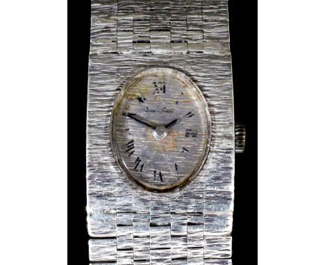 A lady's 9ct white gold cased manual wind cocktail wristwatch, the oval dial with Arabic numerals, 12mm x 15mm, contained in 