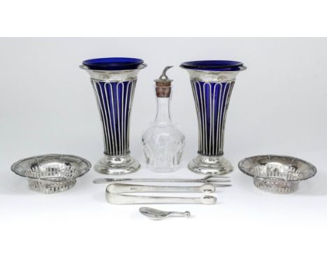 A pair of Edward VII silver trumpet shaped vases, the flared rim with bead mounts and with open wirework bodies, on moulded f