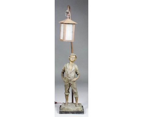 An early 20th Century spelter table lamp modelled as a boy leaning against a lantern, on polished marble base, 25ins high