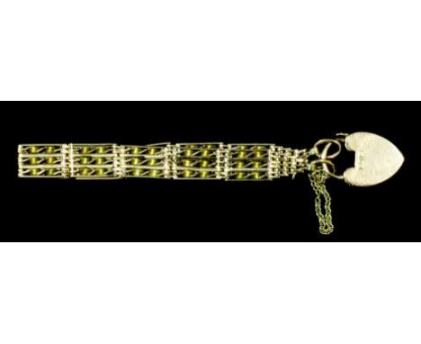 A modern 9ct gold three bar gate bracelet with spiral twist bars and padlock clasp, 200mm overall (gross weight 22.3 grammes)