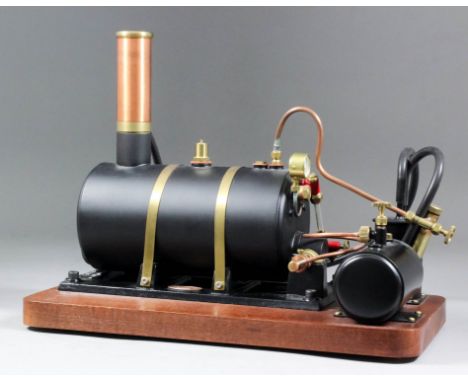 A modern Cotswold Heritage horizontal steam boiler mounted on mahogany base, 11ins x 7ins x 9ins high, and a model of a steam