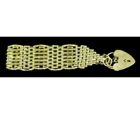A modern 9ct gold seven bar gate bracelet with padlock clasp, 220mm overall (gross weight 29.5 grammes)