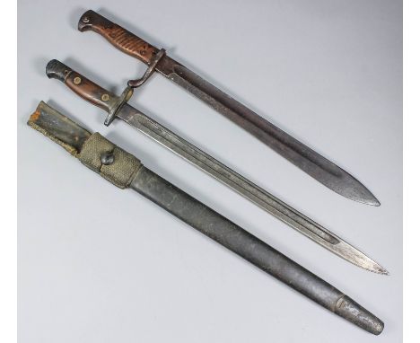 A World War I German "Butcher" bayonet, maker's mark indistinct, 14.5ins fullered blade, 19.5ins overall, and a British 1907 