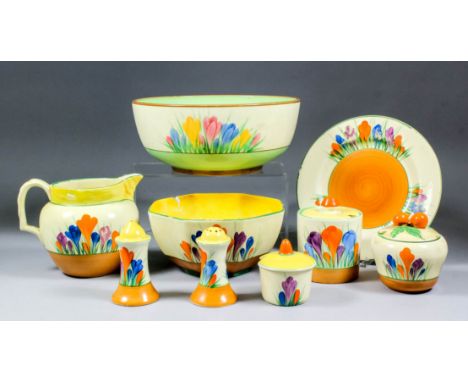 A Clarice Cliff "Honeyglaze" "Crocus" pattern pottery bowl, 8.5ins diameter, and eight other "Bizarre" "Crocus" pattern piece