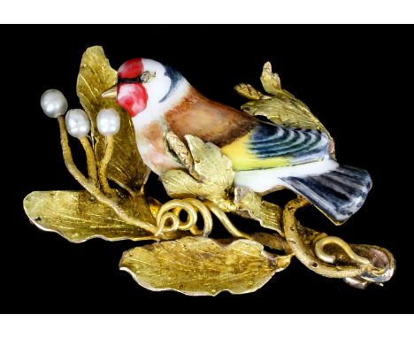 A 20th Century Continental gold coloured metal mounted and enamel brooch in the form of a bullfinch perched on a leafy branch