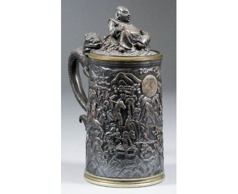 A 19th Century plated tankard and cover in the Chinese manner, cast in relief with a hunting scene, a handle modelled as a dr