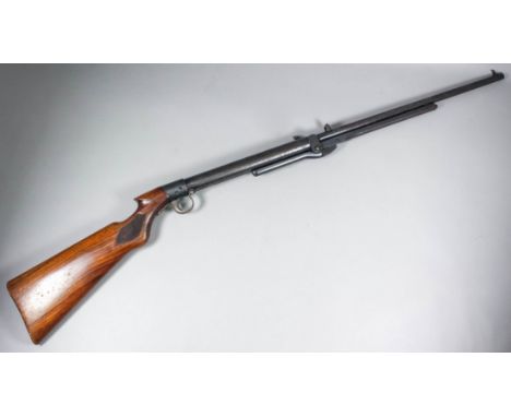An early 20th Century B.S.A. .22 calibre underlever air rifle Serial No. S7562, the 19ins barrel with adjustable sights, plai