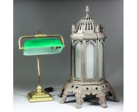 A late Victorian cast iron octagonal oil stove with pinnacle top inset with frosted glass panels, on bracket feet, 23.5ins hi