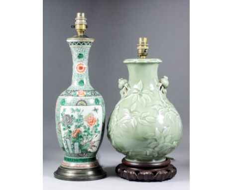 A Chinese "Famille Verte" porcelain baluster shaped vase, enamelled with flowering peonies, bamboo and rock work (blue concen