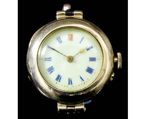 A lady's 18ct gold cased manual wind wristwatch, the white enamel dial with blue and red Roman numerals, contained in case en