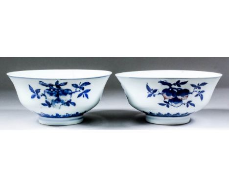 A pair of Chinese porcelain underglaze blue and copper red "peach" bowls, 7.75ins (19.5cm) diameter x 3.5ins (8.9cm) high (Qi