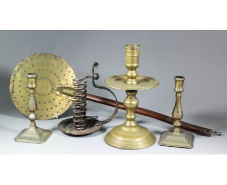A Dutch brass Heemskirk candlestick after a 17th Century original, 10.5ins high, a matched pair of early 18th Century English
