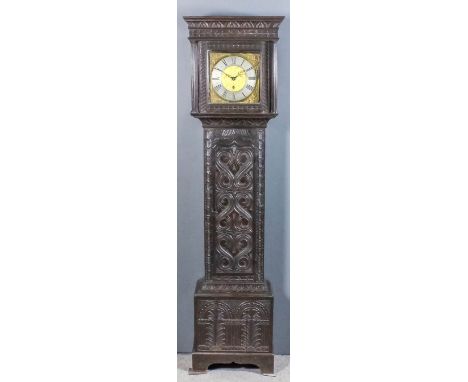 An 18th Century dark oak longcase clock by John Bunting of Long Buckby, the 11ins square brass dial with silvered chapter rin