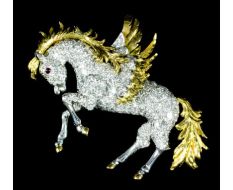 A modern gold and silvery coloured metal mounted diamond Pegasus pattern brooch, pave set with diamonds and with ruby eye, 52