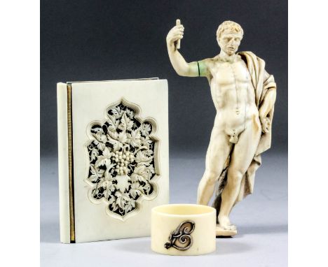 An 18th Century European carved ivory figure of a naked standing male figure, his right arm raised, a cloak draped over his l