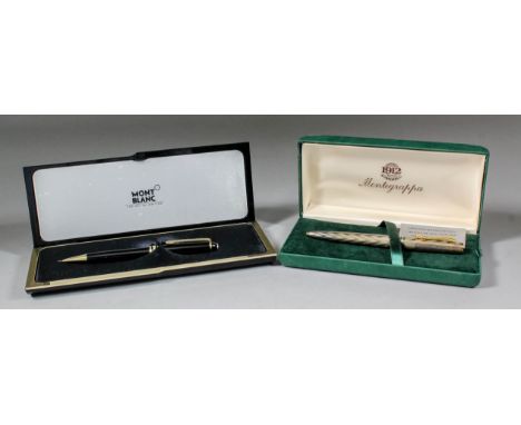 A modern Montblanc pencil in fitted case, and a Montegrappa silvered case biro with engine turned and chevron pattern case, c