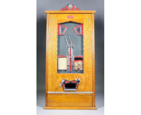 A 1960's Bryan's "Pyramid" penny-in-the-slot flicker machine with twin adjustable pointers, in oak and chromium plated case, 